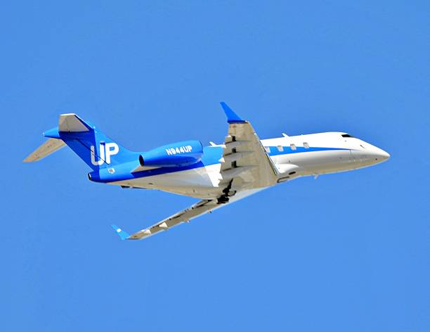 Boca Raton, Palm Beach County, Florida, USA, January 20, 2026.  A Bombardier fixed wing multi engine (8 seats / 2 engines) N944UP taking off at the Boca Raton Airport.