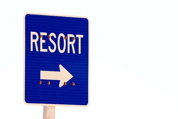 Street signs mark the meeting of Diamond Head Road and Beach Road, guiding the way along Honolulu's coastal path.