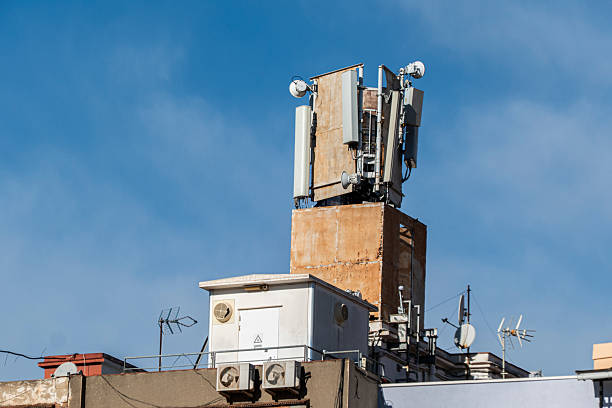 Rooftop telecommunications base transceiver station (BTS). This equipment facilitates wireless communication by transmitting and receiving radio signals for mobile devices.