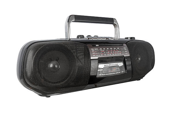 Retro silver tape recorder with radio tuner isolated on a white background