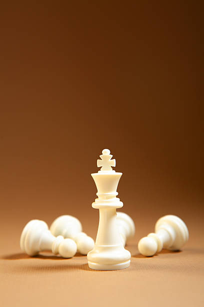 White chess queen on pink