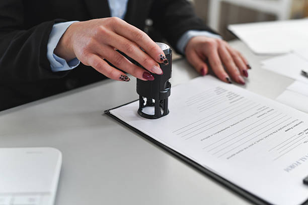 istock Professional Office Stamp: Signing Contracts and Reviewing Documents at the Desk 2260308365
