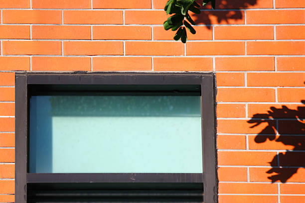 black window frame on orange brick retro wall minimal style
