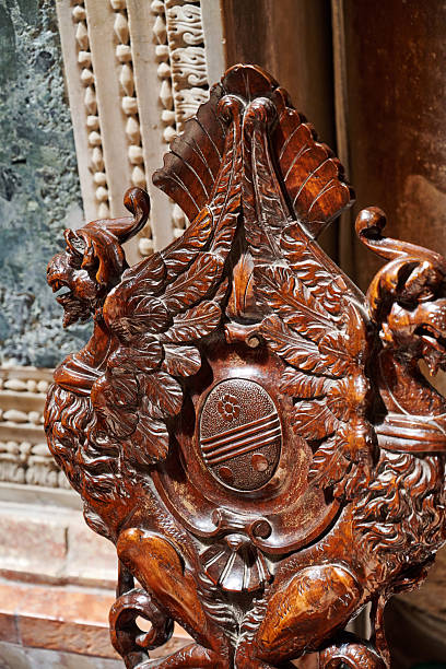 Detail of a carved wooden chair inside St. Mark's Cathedral. Venice. Veneto. Italy.