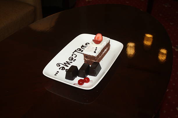 Printed or marked knife and fork made with cocoa powder in white plate with copy space.Not an illustration