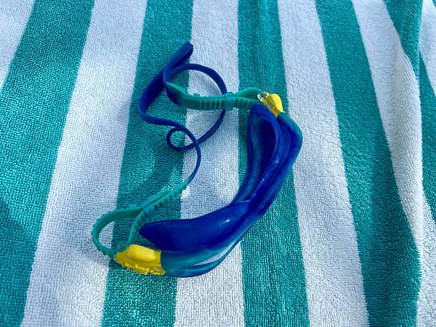 The Hand of a Senior Man Holding Swimming Goggles