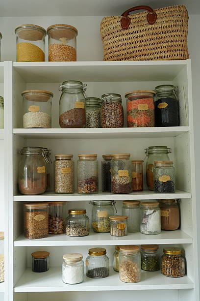 Organized Pantry Shelf with Diverse Food Jars