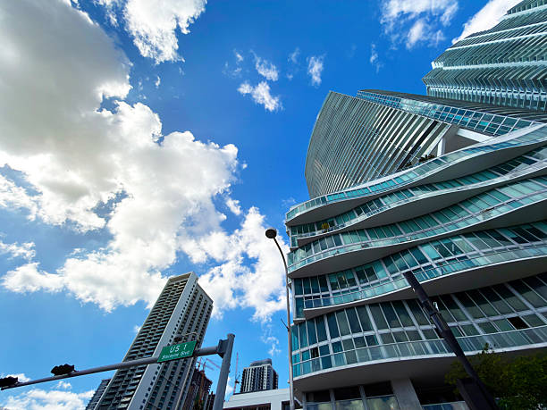 A vibrant view of Miami’s Brickell district, known for its modern skyscrapers, sleek architecture, and dynamic urban atmosphere. The financial heart of the city stands tall with glass towers, bustling streets, and a contemporary skyline that reflects Miami’s energy and growth.