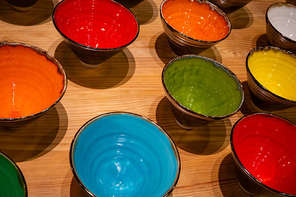 Display of colorful Majorcan ceramic bowls each positioned to underline the vividness of their interiors. Part of a series.