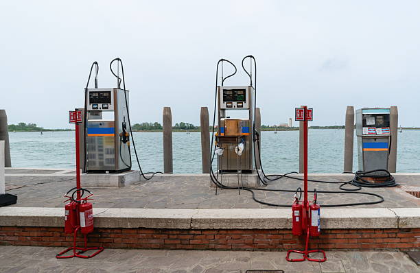 Boat fuel pumps at marina dock by the water