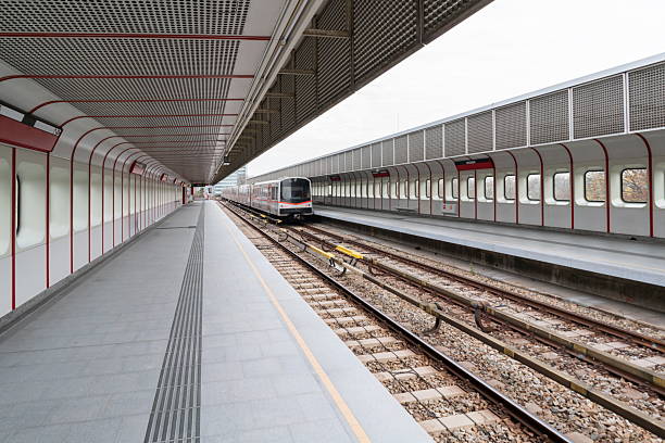 Vienna metro platform with modern train and long perspective