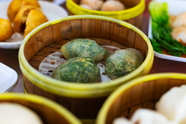 Steamed Chinese Chive Dumplings in Bamboo Steamer