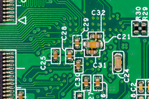 Close-up view of a green pcb illustrating traces and electronic components