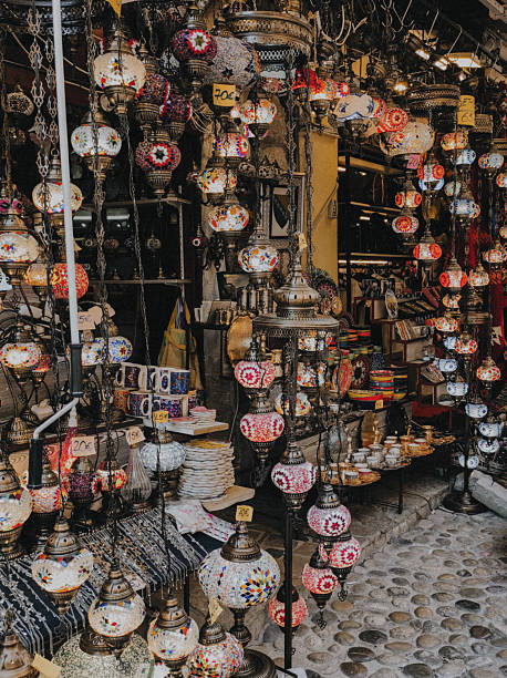 Authentic Balkan bazaar scene with colorful oriental mosaic lamps hanging in a traditional market shop, Bosnia and Herzegovina. Warm vintage photo style