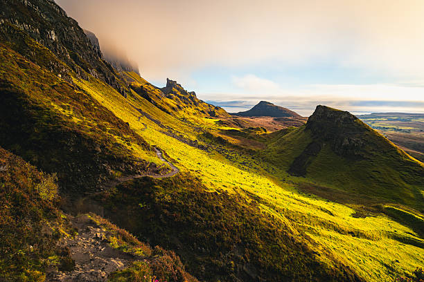 istock Mountain valley with rolling hills, cliffs and winding path in natural landscape 2260409308