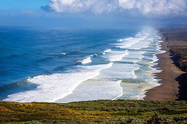 Scenic aerial view of South Cove Beach at Point Reyes California with rugged coastline, ocean waves, and natural shoreline landscape