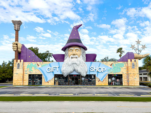 Orlando, USA; December 09, 2025 :   Eye catching building architecture on Highway 192 in Kissimmee, Florida, USA.  This is a unique store with the head and arms of a wizard attracting in tourists looking to but Florida merchandise.