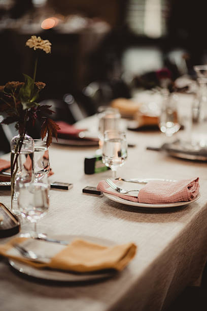 Wedding reception table setting with plates and menu