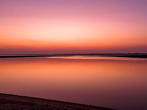 Sunset over the lake, beautiful evening glow