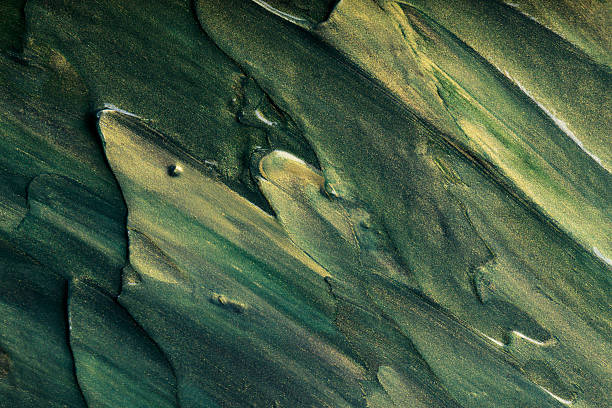 Dark Green Gold Metallic Paint Brushstroke Texture Abstract Background with Shimmering Pattern