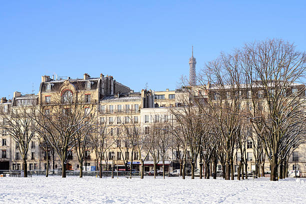 Parisian cityscape under snow, with a view on the Eiffel Tower. Esplanade des Invalides. Paris in France, January 6th, 2026