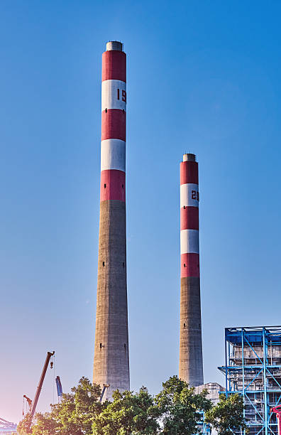 Industrial chimneys against blue sky
