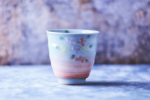 Traditional japanese ceramic on rustic wooden background. Soft focus. Copy space.