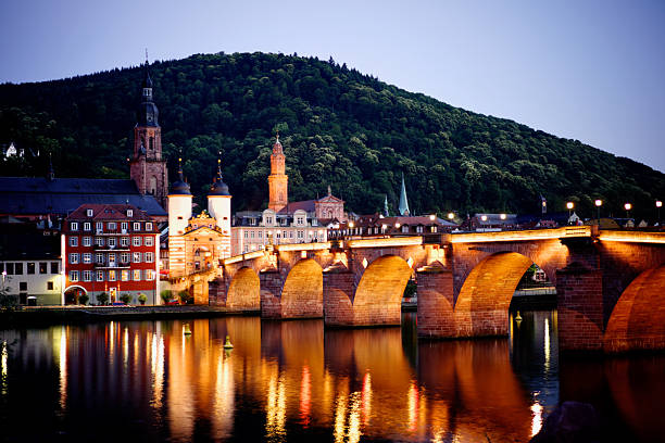 The Alte Brücke (Old Bridge), officially the Karl-Theodor Bridge, is a historic stone bridge spanning the Neckar River in Heidelberg, Germany. Built between 1786 and 1788 under Elector Karl Theodor, it replaced several earlier wooden bridges. The bridge is famous for its Baroque bridge gate, the statues of Karl Theodor and the goddess Athena, and the iconic Brass Monkey statue. It offers a stunning view of Heidelberg Castle and the Old Town. A beloved symbol of the city, it is a key pedestrian route and a major tourist attraction, perfectly embodying Heidelberg's romantic charm.