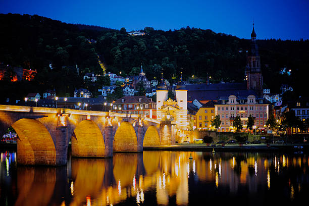 The Alte Brücke (Old Bridge), officially the Karl-Theodor Bridge, is a historic stone bridge spanning the Neckar River in Heidelberg, Germany. Built between 1786 and 1788 under Elector Karl Theodor, it replaced several earlier wooden bridges. The bridge is famous for its Baroque bridge gate, the statues of Karl Theodor and the goddess Athena, and the iconic Brass Monkey statue. It offers a stunning view of Heidelberg Castle and the Old Town. A beloved symbol of the city, it is a key pedestrian route and a major tourist attraction, perfectly embodying Heidelberg's romantic charm.