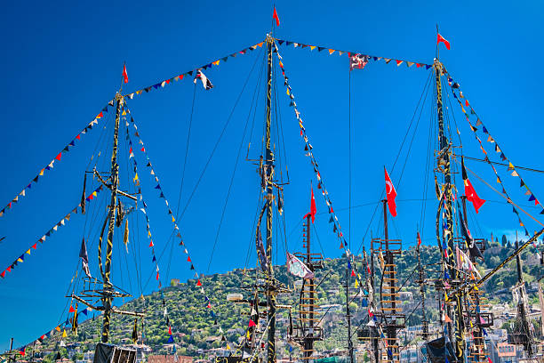 Alanya, Turkey  april 12, 2025: colorful flags on the masts of ships