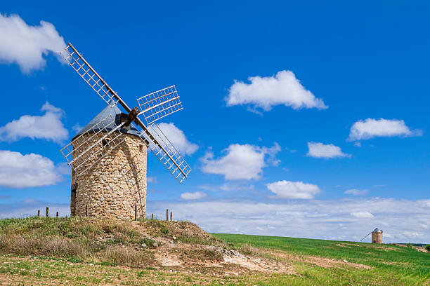 Isolated windmills in the countryside of Belmonte, a town in the Castilla-La Mancha
