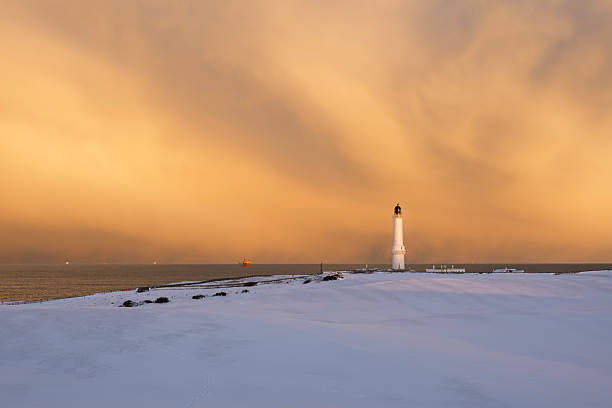 Girdle Ness Lighthouse, Aberdeen, in the snow at Sunset