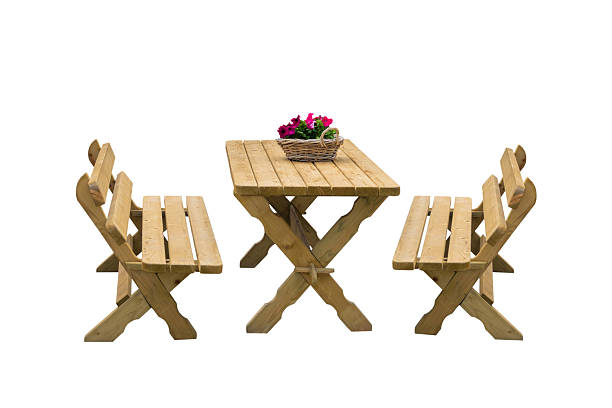 New empty pine wood picnic table on a green meadow in a public park