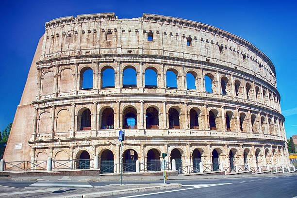 The Colosseum is the largest ancient amphitheatre ever built at sunny day in Rome, Italy