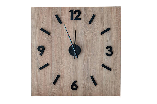 wall square clock made of wood. wall clock isolated on a white background