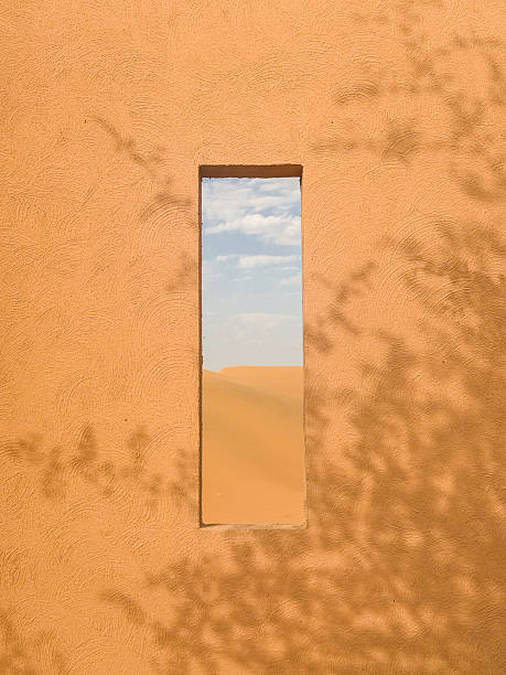 Desert window Arch with aesthetic view over sand dunes in Liwa on sunny day