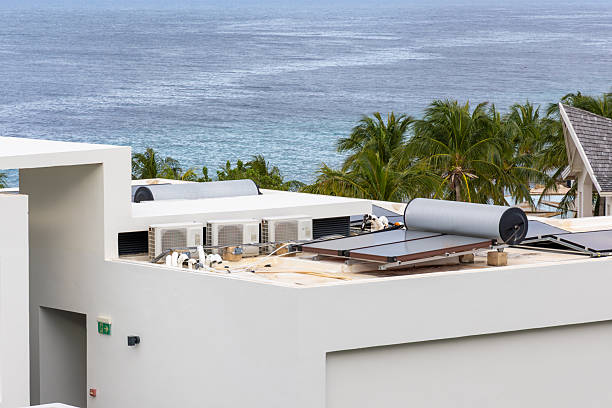 Sustainable hotel rooftop with solar energy at tropical coastal resortDescription
