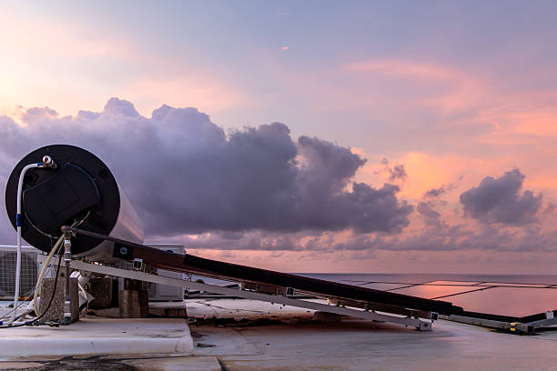 Sustainable hotel rooftop with hot water and cooling systems at sunrise