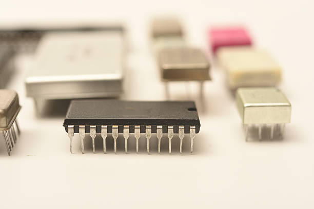 Old chips on a white background. Electronic components. Processors in metal and plastic cases.