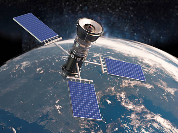 A sophisticated communication satellite equipped with solar panels orbits the planet Earth, transmitting signals to the ground as it traverses the outer atmosphere against the backdrop of a starry sky.