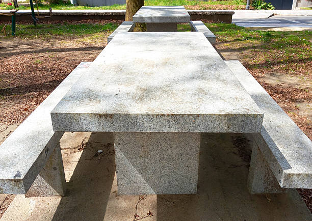 Picnic granite stone tables and benches in a public park.  Pontevedra province, Galicia, Spain.