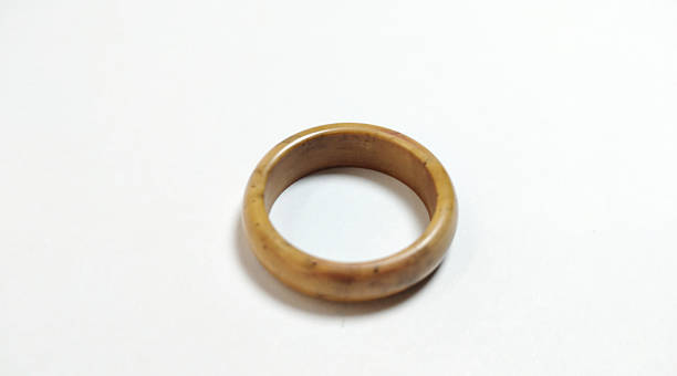 wooden ring, creative and unique craft, typical brown wood color, white background,