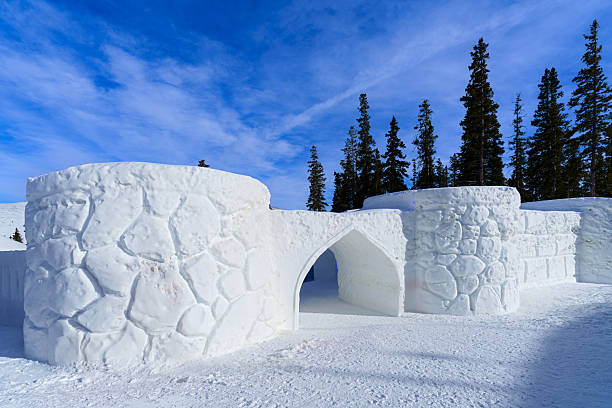 Snow fort shaped into an ice castle at top of mountain area.