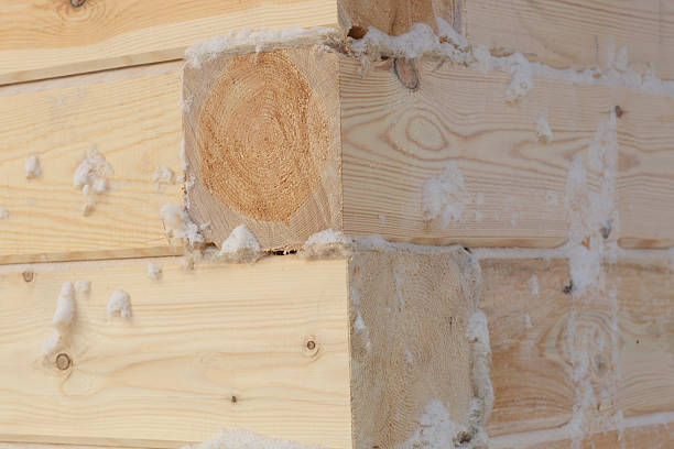 Construction of a wooden house from timber with trim.