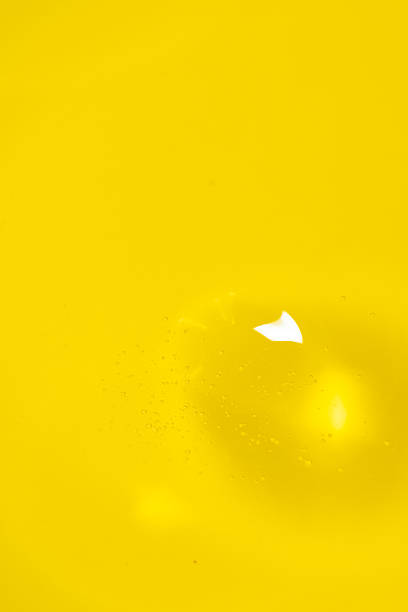Yellow water drop on a black background.