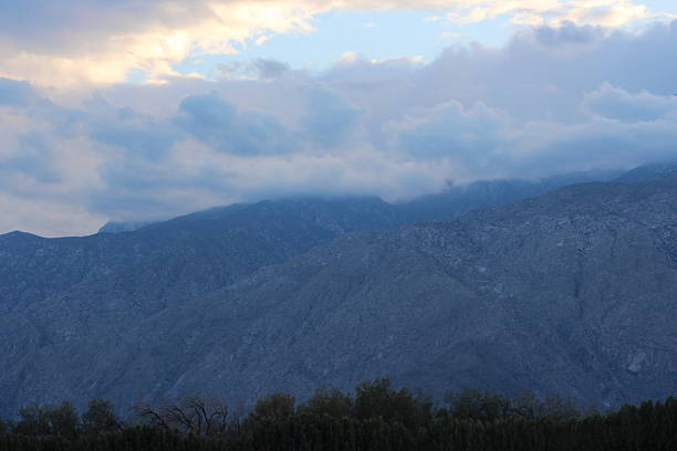 Desert Mountain Range Landscape and cloudscape found in eastern San Bernardino County, California, near Blythe and the Whipple Mountains located west of the Colorado River while driving I10, the east-west Interstate Highway.