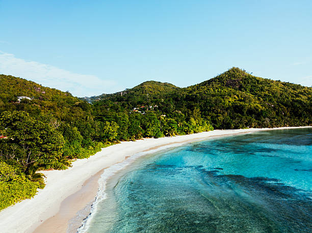 istock Seychelles tropical beach with turquoise water and lush mountains 2260594262