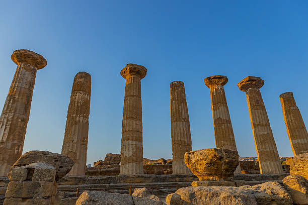 Doric columns of the Temple of Heracles rise amid ancient ruins in Agrigento’s Valley of the Temples, Sicily, Italy