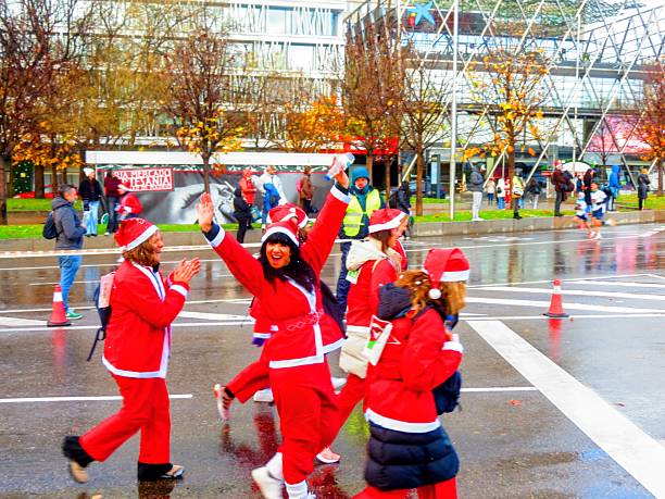 Madrid, Spain - December21 , 2025  Santa Clauses walking in city  Street .