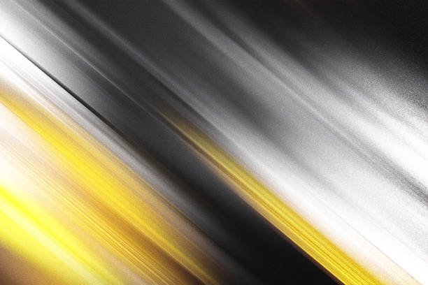 Abstract speed motion background featuring dynamic diagonal streaks of yellow light and brushed silver metal textures